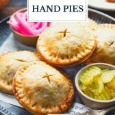 Ground beef and cheddar meat pies with text title overlay.