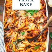 Sausage and spinach penne pasta bake with text title overlay.