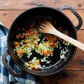 Sauteing vegetables in a Dutch oven.