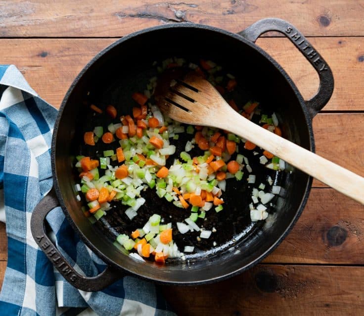 Sauteing vegetables in a Dutch oven.
