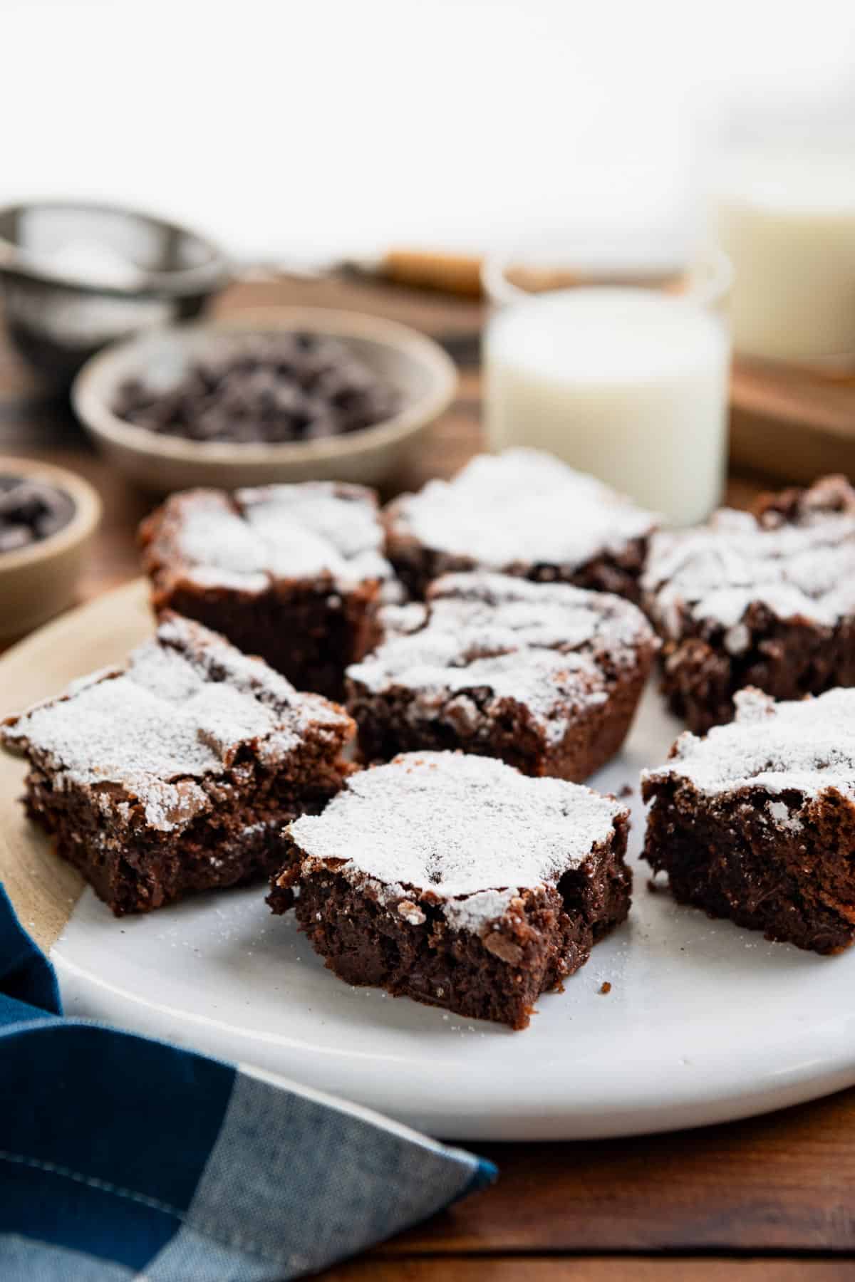 Tray of homemade brownies on a wooden table.