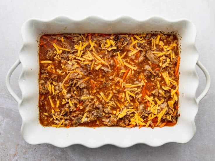 Combining the ingredients in the baking dish.