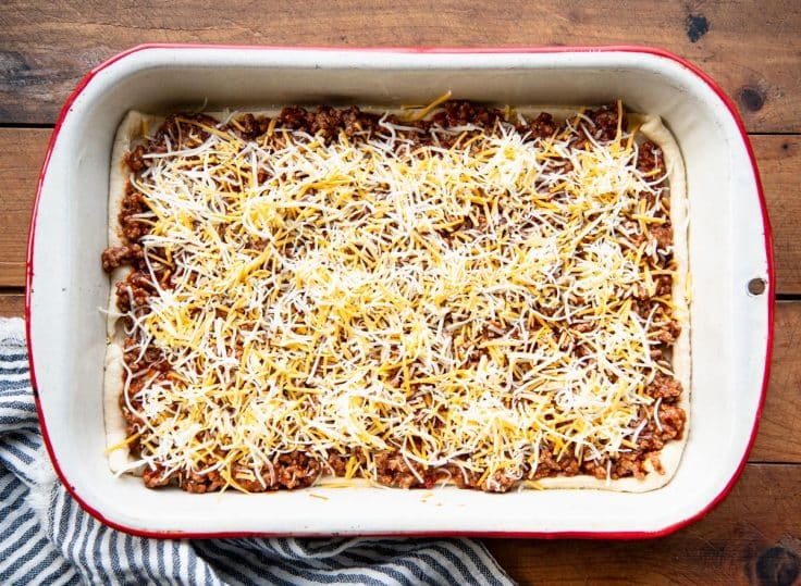 Process shot showing how to make sloppy joe casserole.