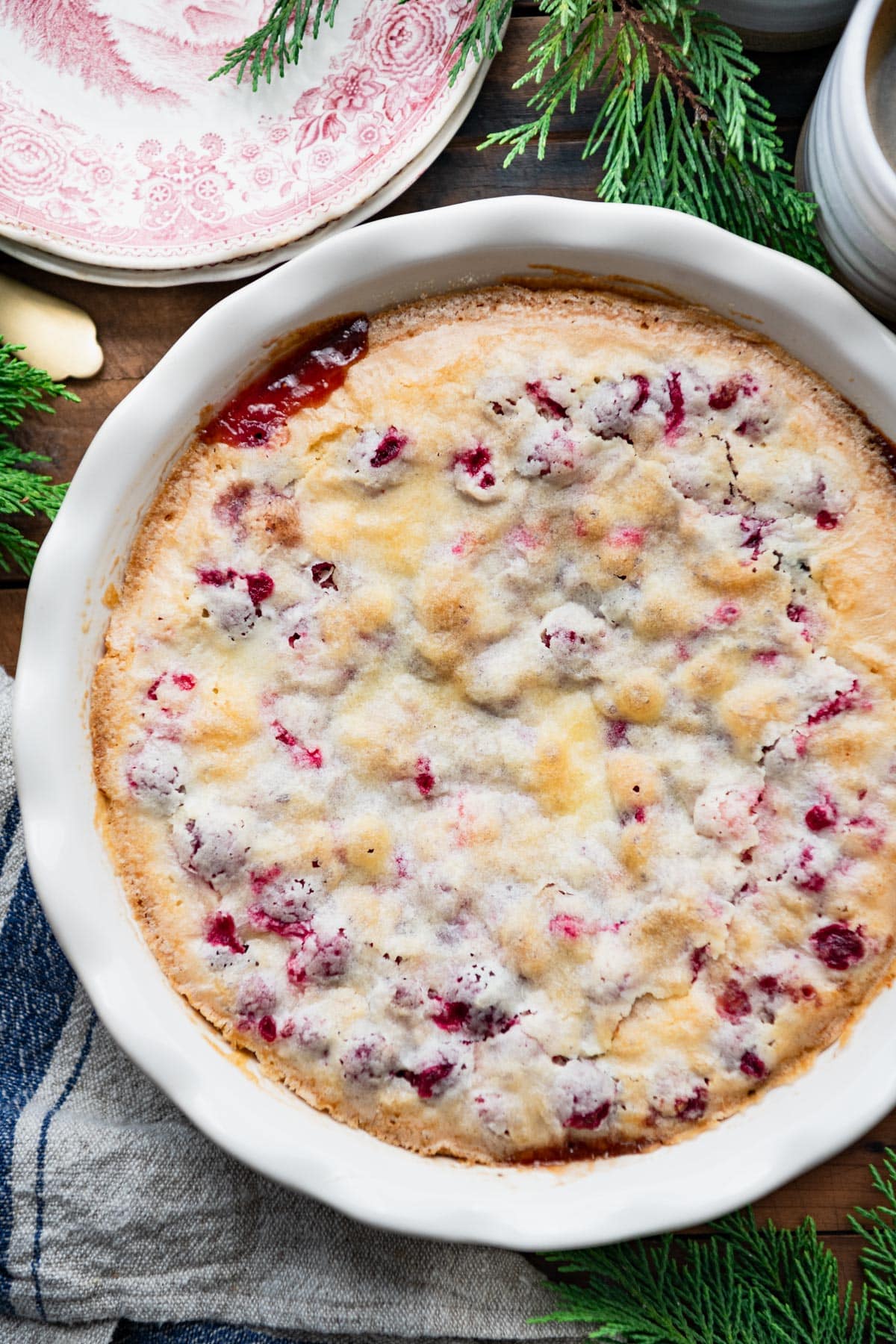 Close overhead image of a cranberry pie recipe in a white dish.