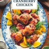 Plate of crock pot cranberry chicken with text title overlay.