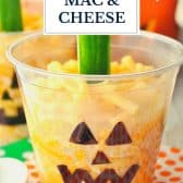 Easy Halloween dinner of jack o lantern mac and cheese cups with text title overlay.