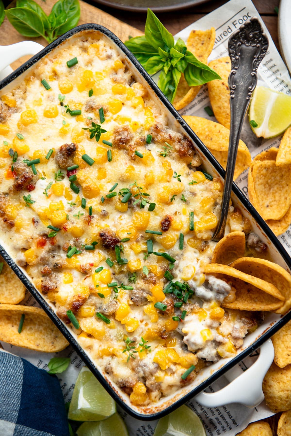 Close overhead image of sausage dip with corn and cheese.