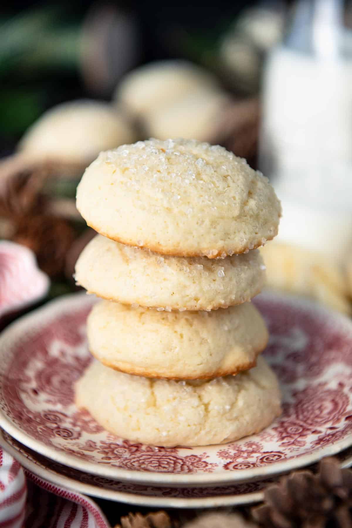 Close up side shot of a stack of drop sugar cookies with sour cream.