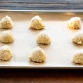 Drop sugar cookies on a baking sheet before they go in the oven.