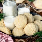 Serving tray of the best drop sugar cookies recipe served with a side of milk.