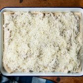 Chicken alfredo crescent roll bake in a pan before baking.