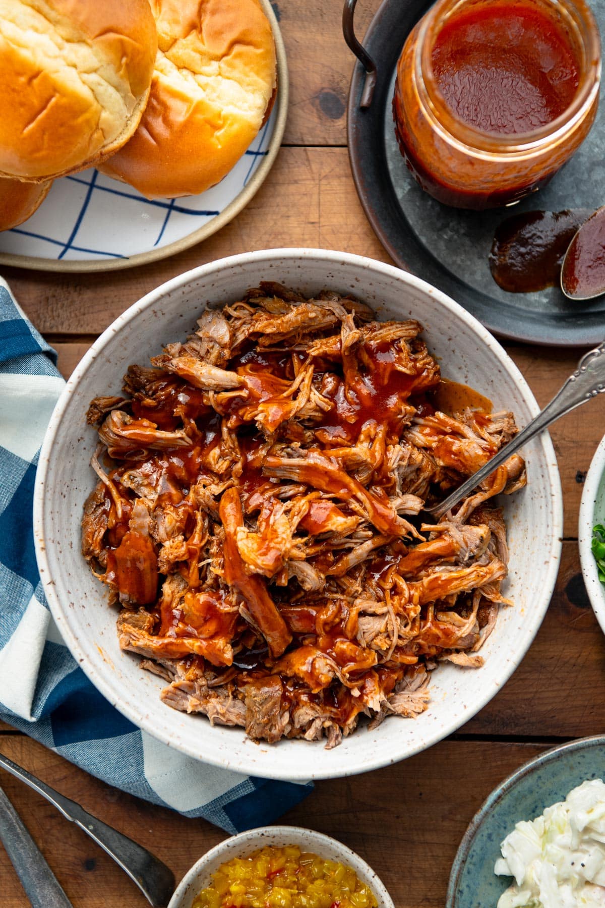 Overhead shot of beer pulled pork in a bowl with maple bbq sauce.