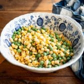 Bowl of frozen peas and corn.