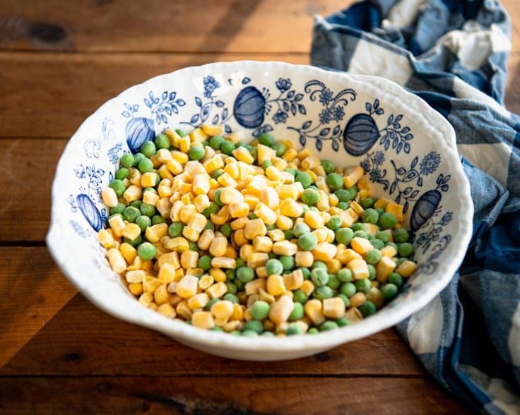 Bowl of frozen peas and corn.