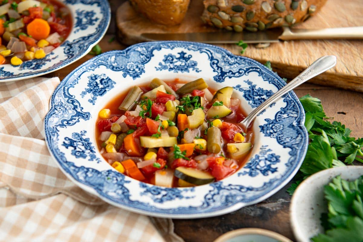 Horizontal image of a bowl of vegetable soup.