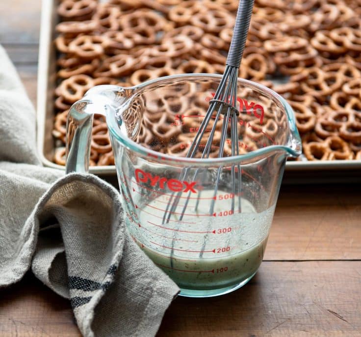 Stirring together ranch seasoning mixture for pretzels.