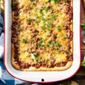 Square overhead shot of a pan of sloppy joe casserole with crescent rolls.