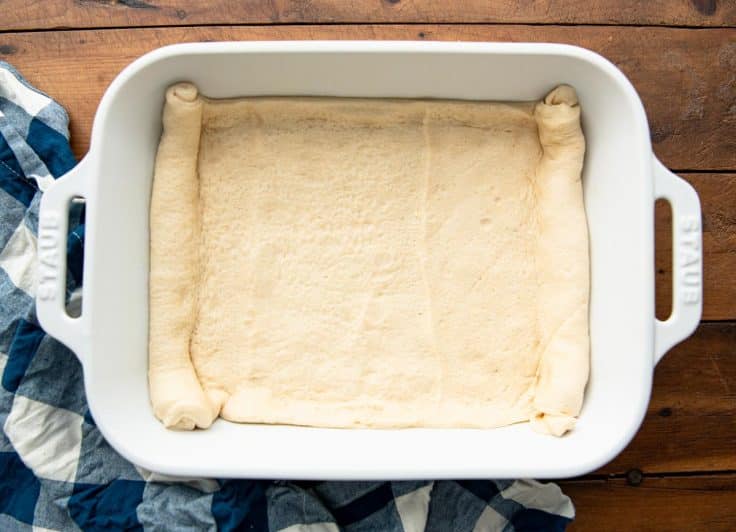 Crescent dough sheet in a baking dish.