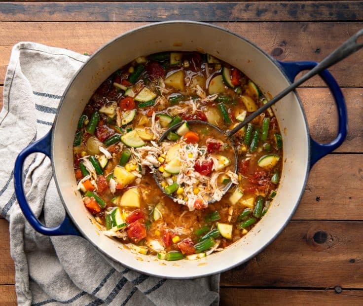 Overhead image of turkey vegetable soup recipe in a Dutch oven.