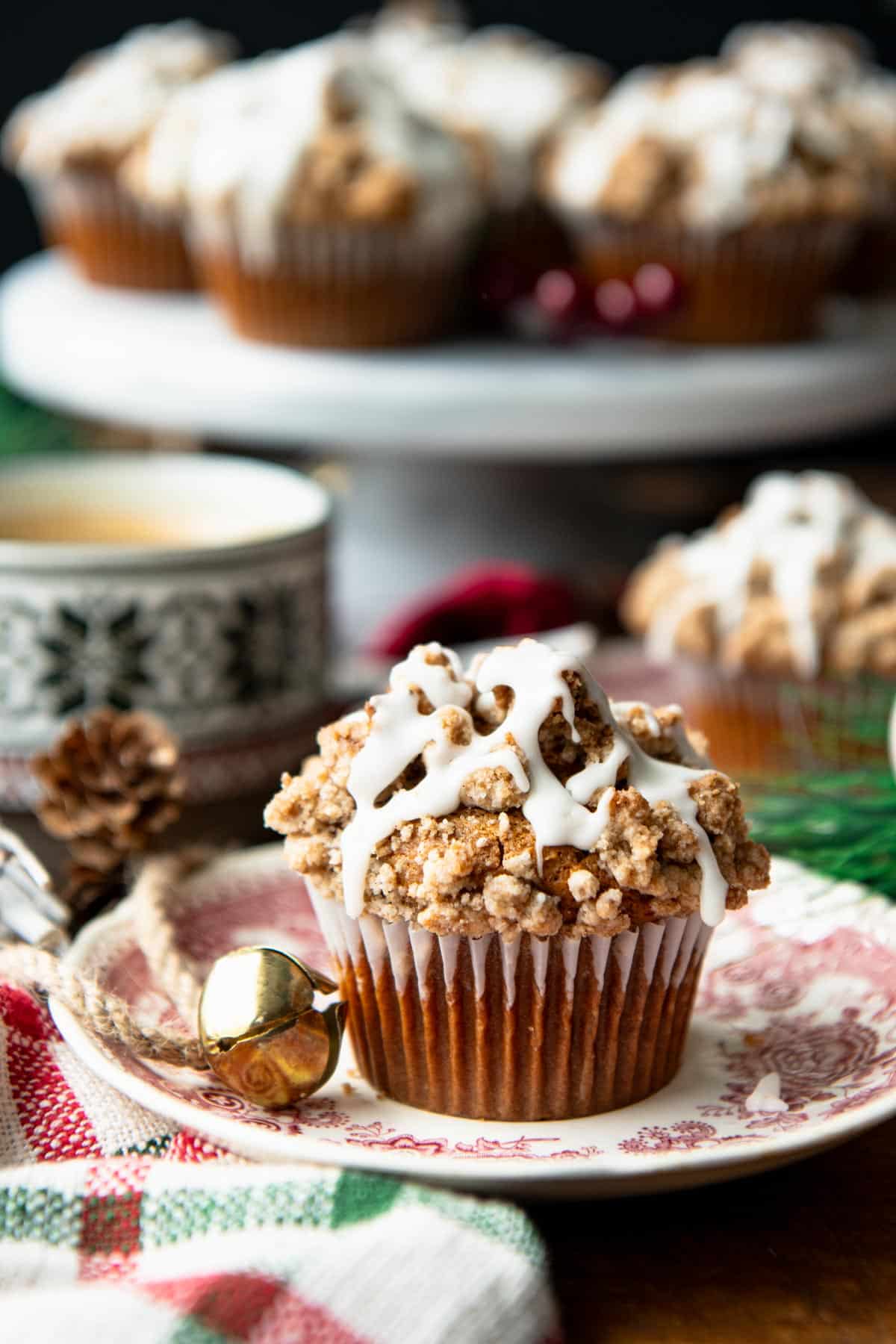 Gingerbread muffins with holiday decorations on a breakfast table.