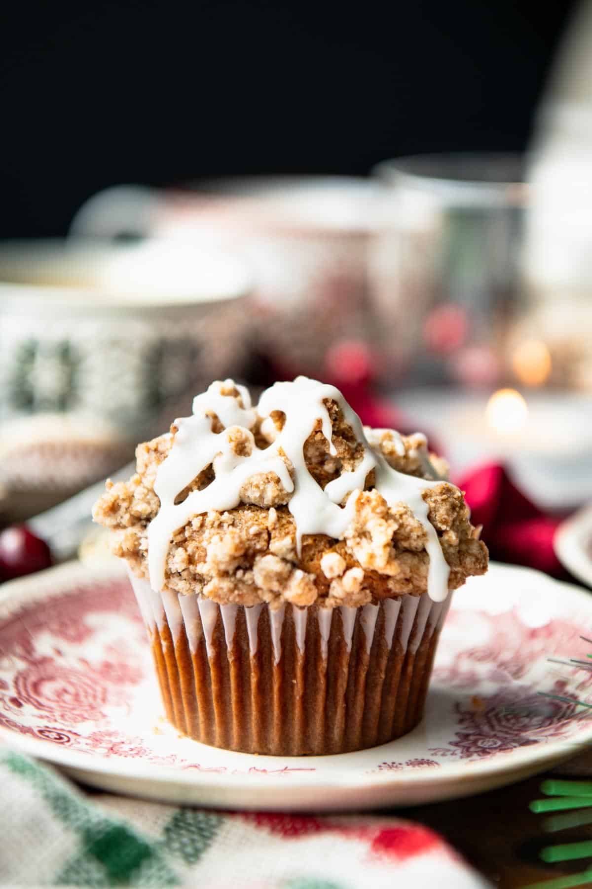 Gingerbread muffins on red and white plates on a Christmas breakfast table.