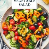 Marinated vegetable salad with text title overlay.