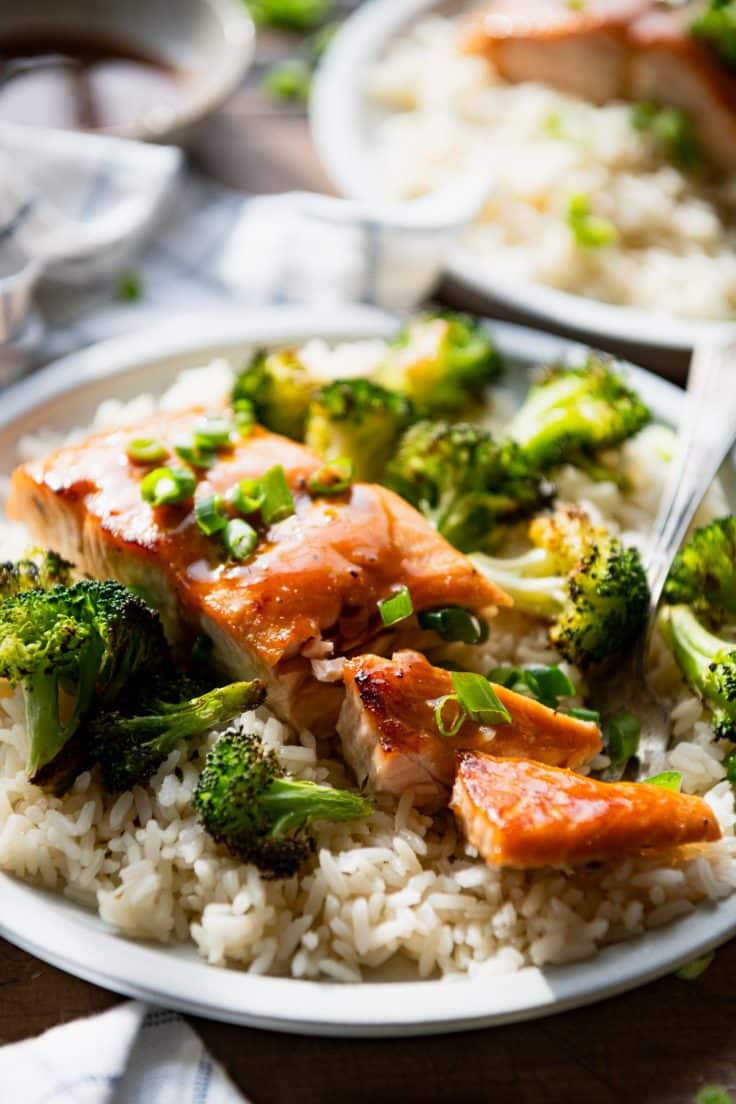 Side shot of honey glazed salmon recipe with broccoli and rice.