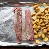 Process shot showing how to make sheet pan pork tenderloin.