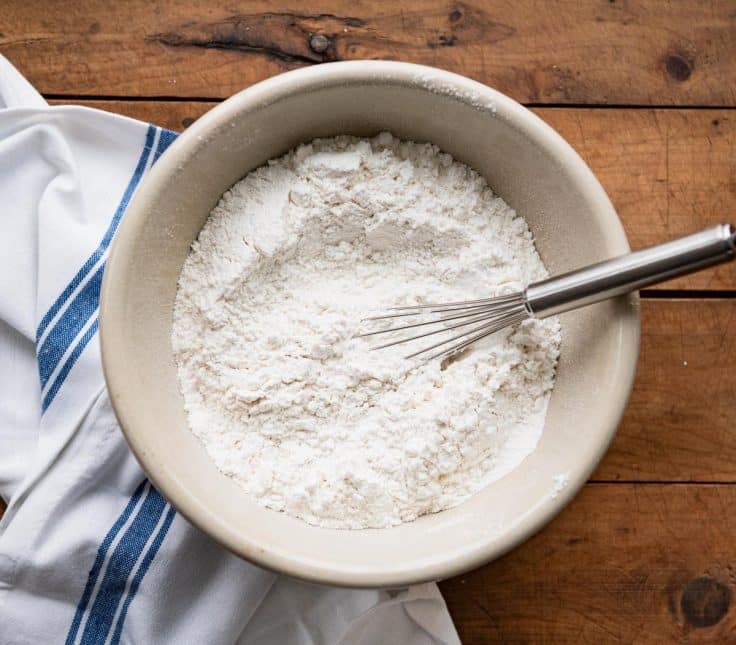 Whisking dry ingredients for carrot cake loaf.