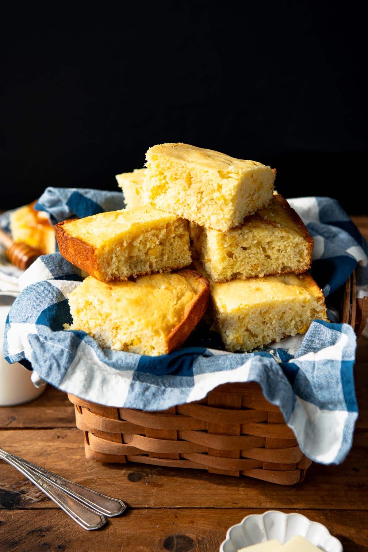 Sweet cornbread squares in a basket.