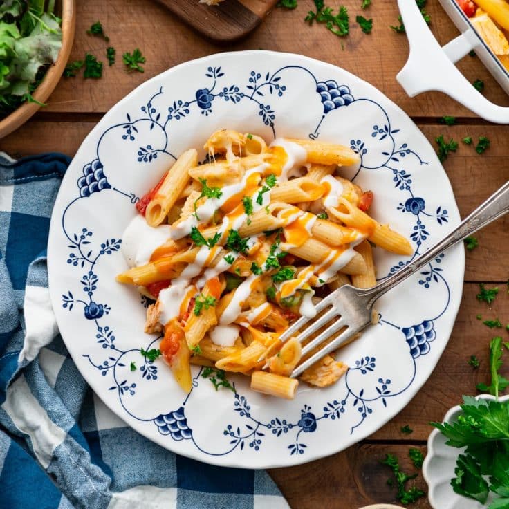 Square overhead shot of a bowl of buffalo chicken pasta.