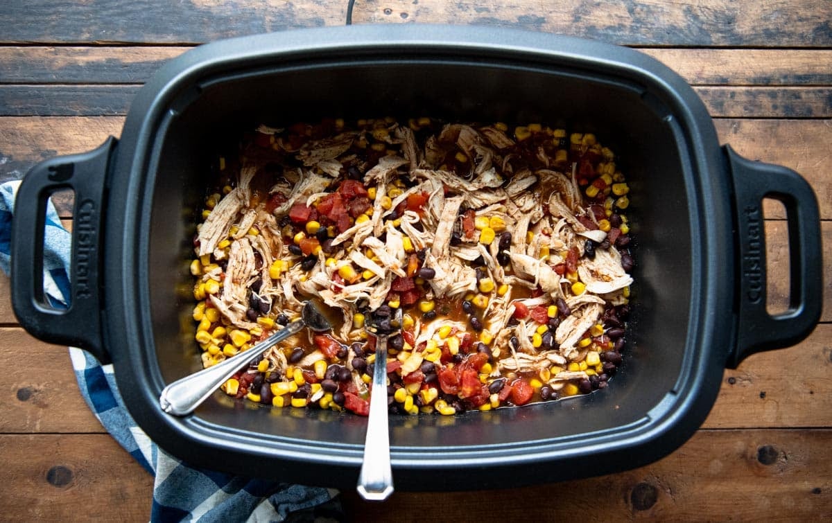 Overhead image showing how to shred crock pot chicken.