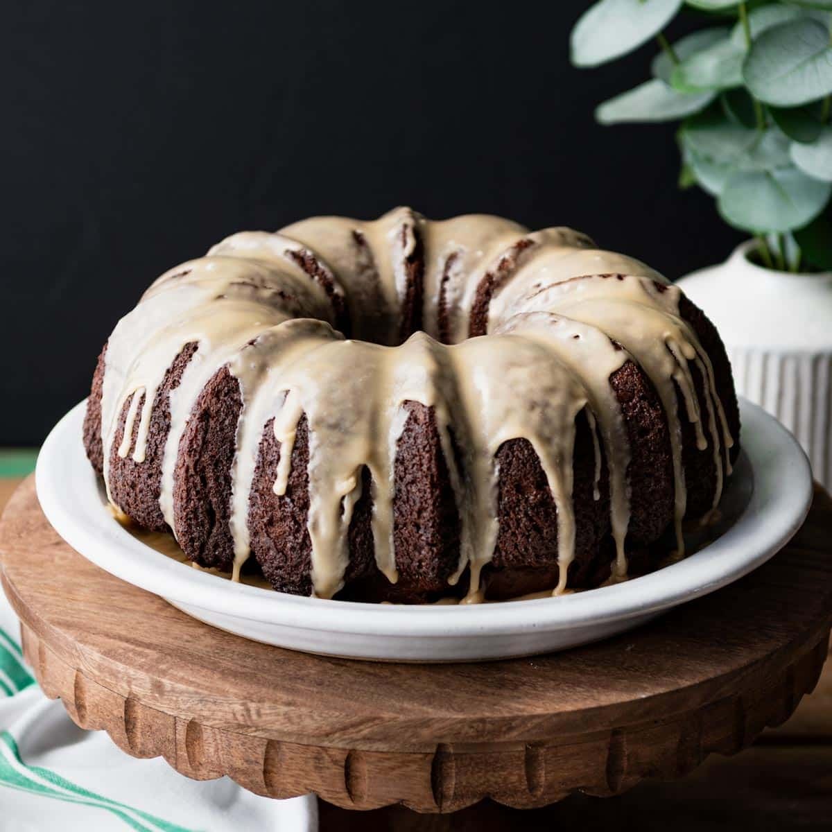 Square side shot of a guinness cake with Irish whiskey glaze before slicing.