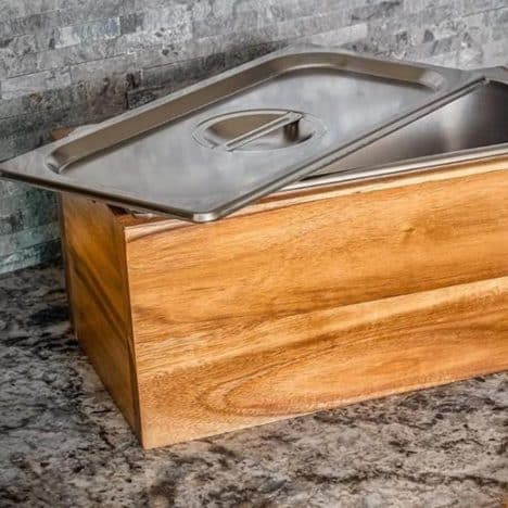 Wooden kitchen compost bin on a counter.