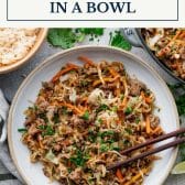 Egg roll in a bowl with text title box at top.