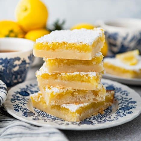 Side shot of a plate full of the best lemon squares recipe.