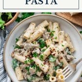 Creamy sausage pesto pasta with text title box at top.