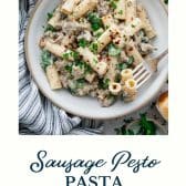 Creamy sausage pesto pasta with text title at the bottom.