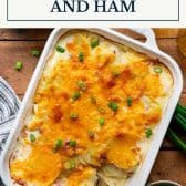 Scalloped potatoes and ham with text title box at top.