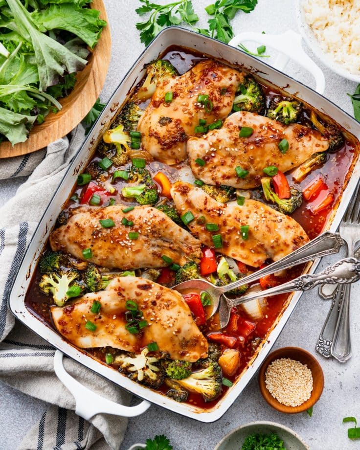 Overhead image of dump and bake teriyaki chicken in a baking dish with vegetables.