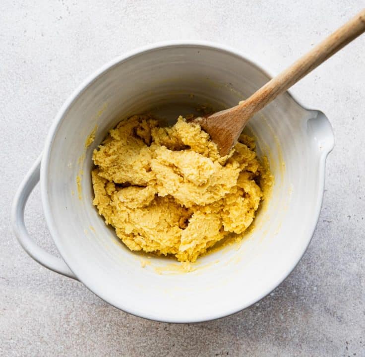 Stirring together crust for chess bars.