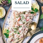 Seafood salad recipe with text title overlay.