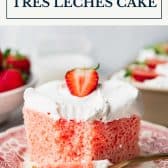 Strawberry tres leches cake with text title box at top.