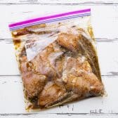 Boneless skinless chicken thighs in the best chicken thigh marinade in a Ziploc bag.