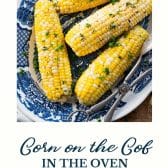Corn on the cob in the oven with text title at the bottom.