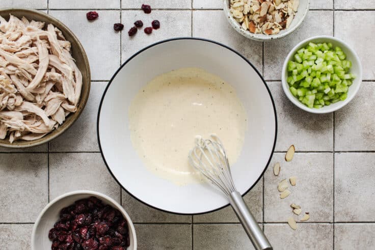 Whisking together the dressing for a southern chicken salad recipe.