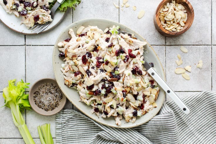 Horizontal overhead shot of an easy chicken salad recipe served in a white oval bowl.