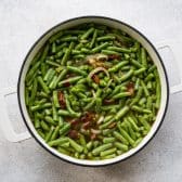 Process shot showing how to make southern green beans.