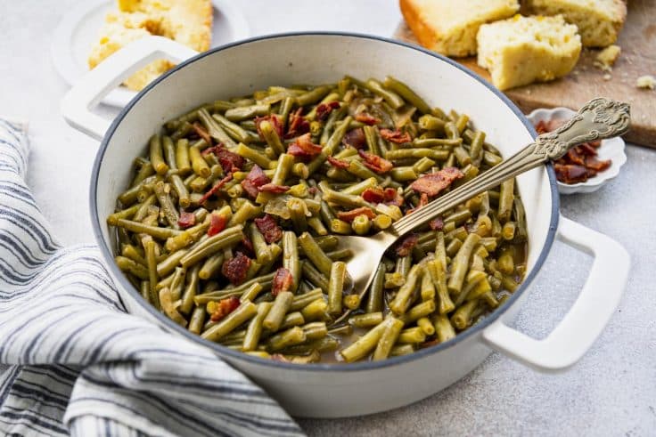 Horizontal shot of a pan of southern style green beans.