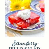 Strawberry jello salad with text title at the bottom.